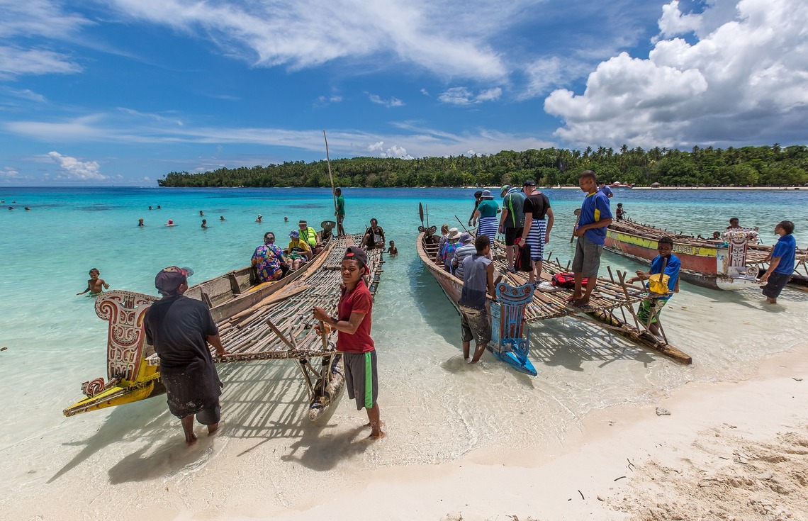 fishermen and tourists in New Guinea - Luxury Yacht Charter Destination