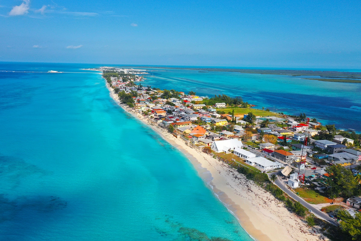 aerial view of several beach houses on a small peninsula - Bahamas Yacht Charters
